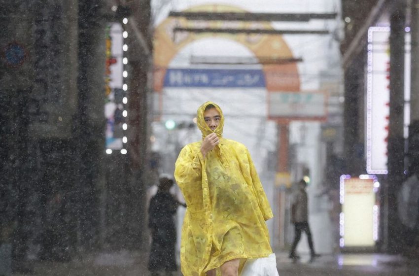  Typhoon batters Japan with record rain, killing two