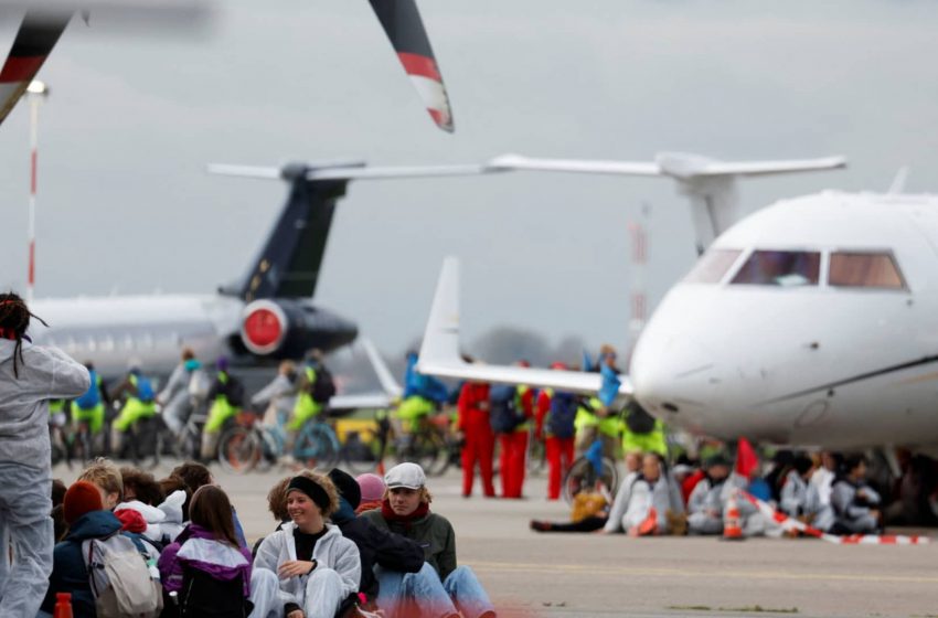  Climate activists swarm private jets at Amsterdam airport to protest pollution