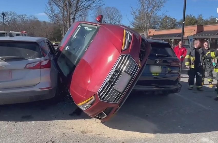  WATCH: Tight spot: Driver gets wedged between cars in Massachusetts parking lot
